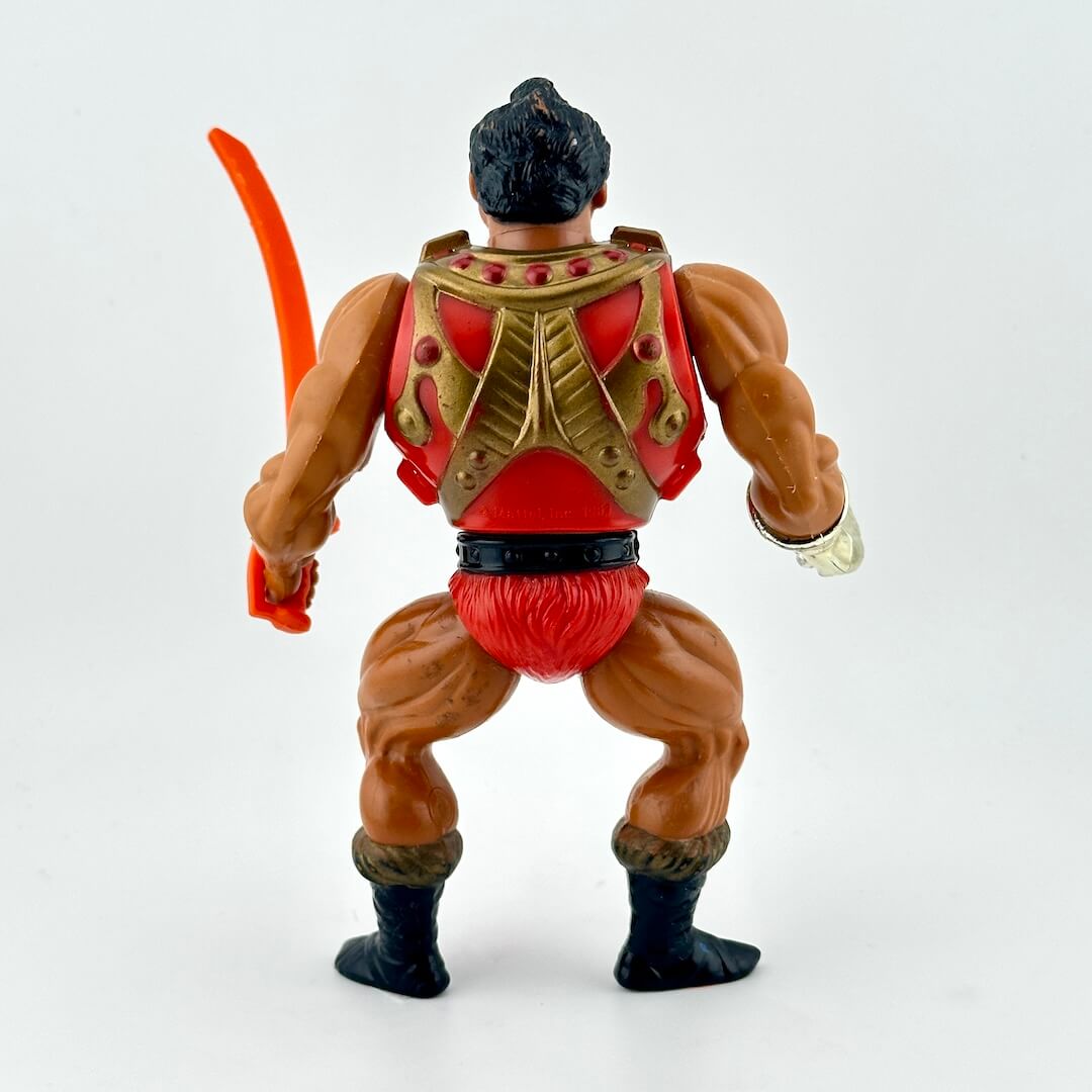Toy figure with red and brown armor on a white background