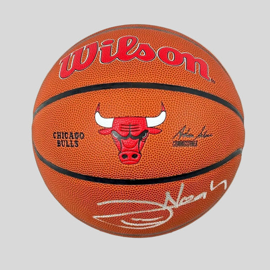 Basketball with Wilson logo and Chicago Bulls branding on a white background