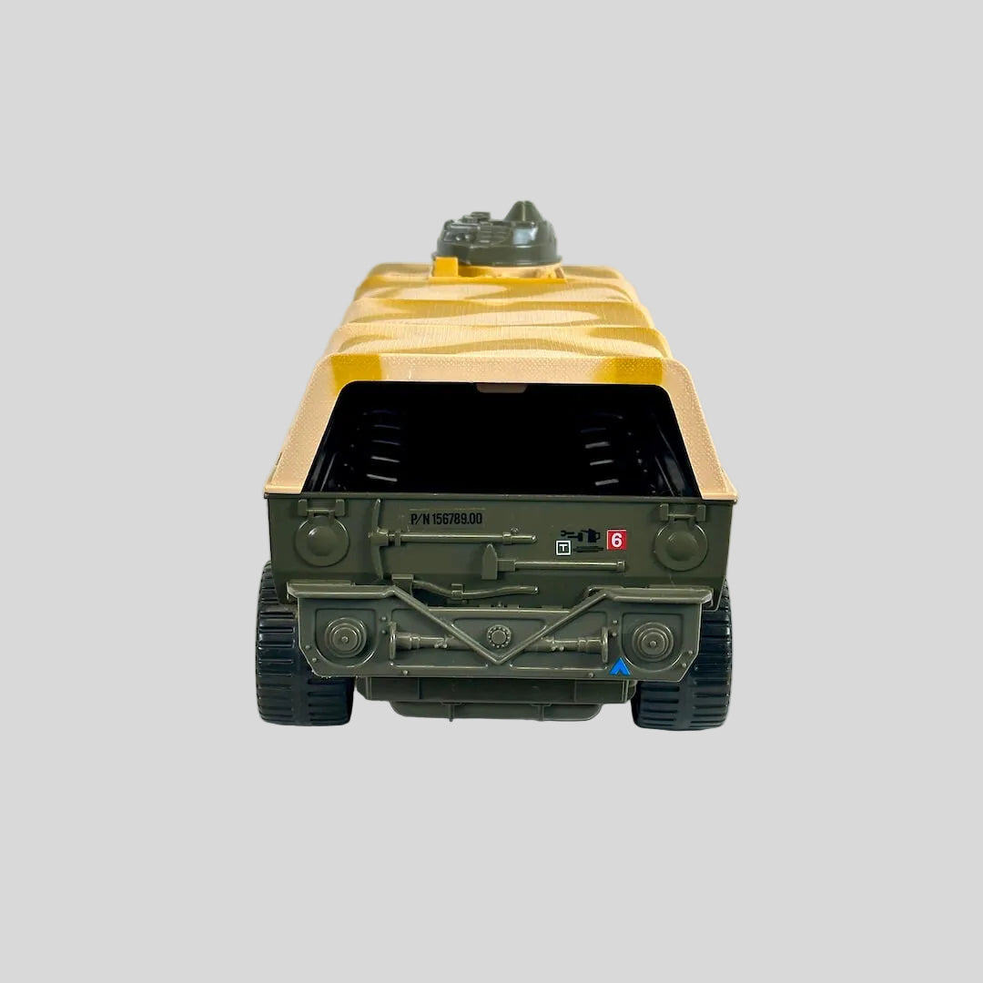 A miniature military toy vehicle, shown from the rear. The vehicle features an olive green chassis and a yellow canvas cover.