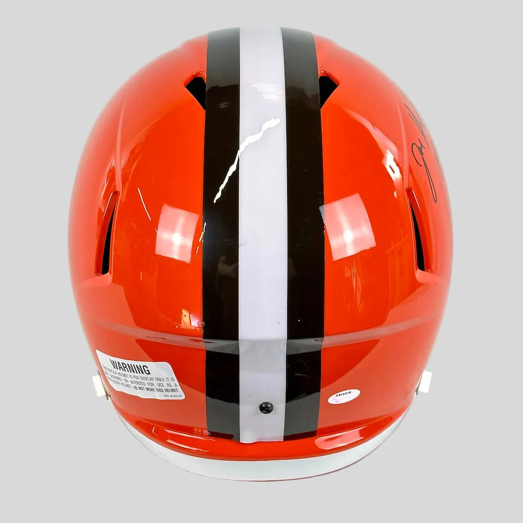Orange helmet with black and white stripes on a white background