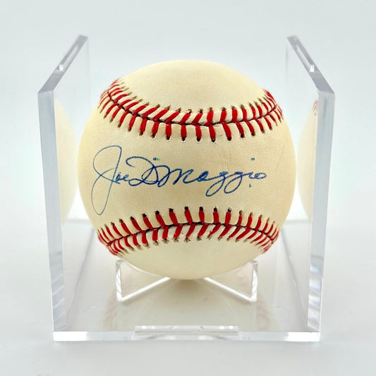 Baseball with a signature in a clear display case on a white background