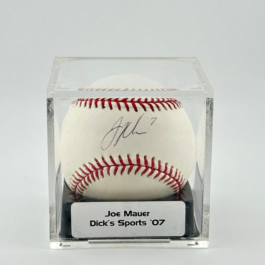 Autographed baseball in plastic cube with sticker label along bottom.