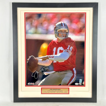 A framed, autographed photo of Joe Montana in his San Francisco 49ers red jersey, signed in silver ink.