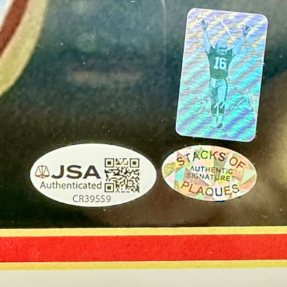Close-up of authentication stickers on photo. One JSA, one from Stacks of Plaques, and another Joe Montana. 