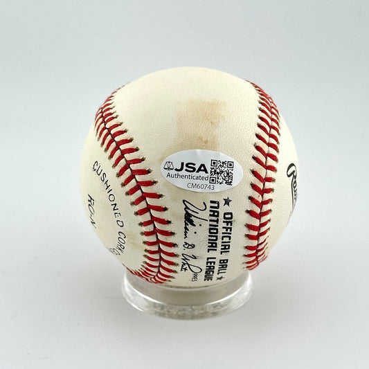 Baseball with JSA authentication label on a white background