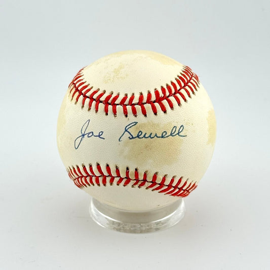 Baseball with red stitching on a white background