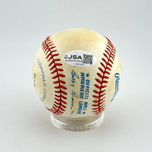 Baseball with JSA authentication label on a white background