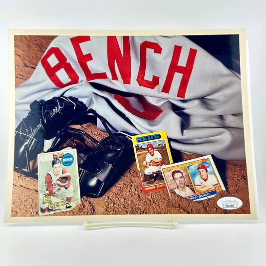 Photograph of memorabilia collage featuring signature of player, JSA authentication sticker in corner. 