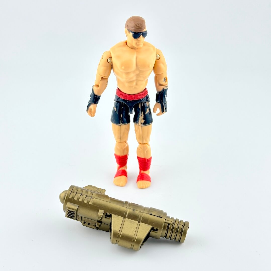 GI Joe/Mortal Kombat action figure of Johnny Cage in black shorts with sunglasses, pictured on white background.