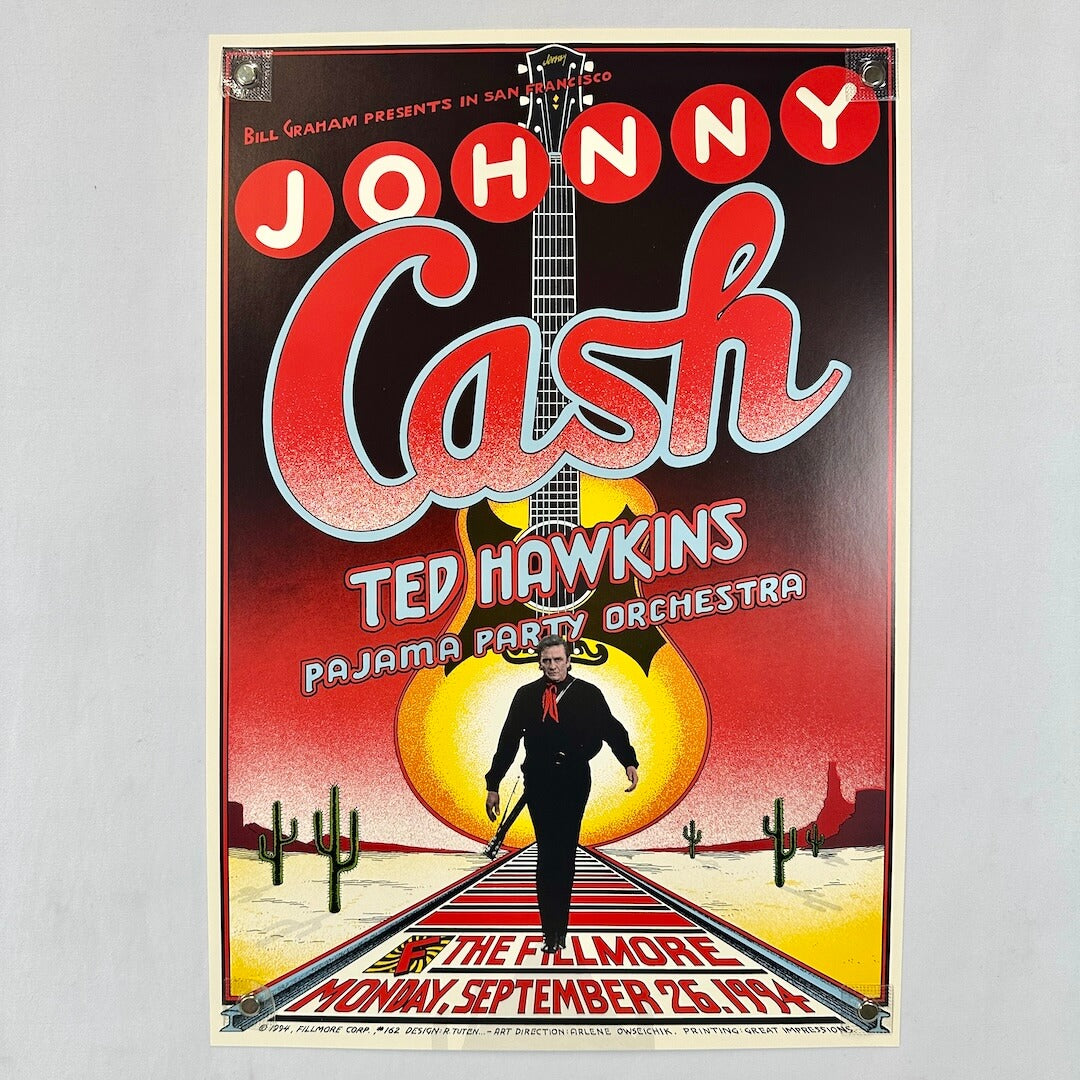 Concert poster for Johnny Cash at the Fillmore with western imagery in background. 