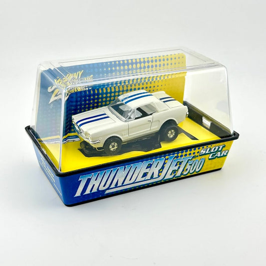 Model car in a transparent display case with 'Thunder Jet 500' branding on a white background