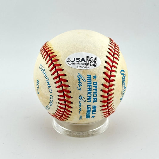 Baseball with JSA authentication label on a white background