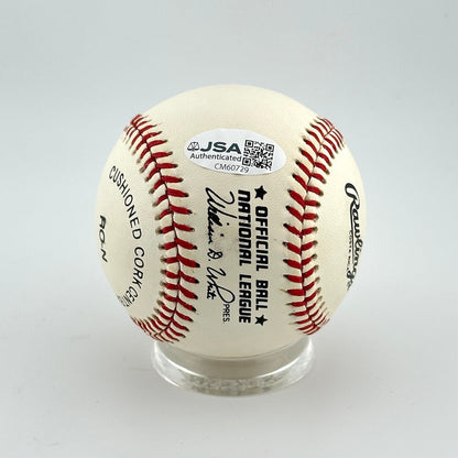 Baseball with JSA authentication label on a gray background