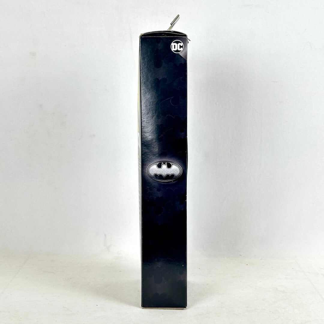 Batman-themed product packaging with DC logo on a white background