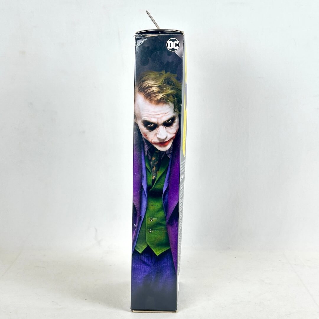 Figure in a box featuring the Joker character from DC Comics on a white background