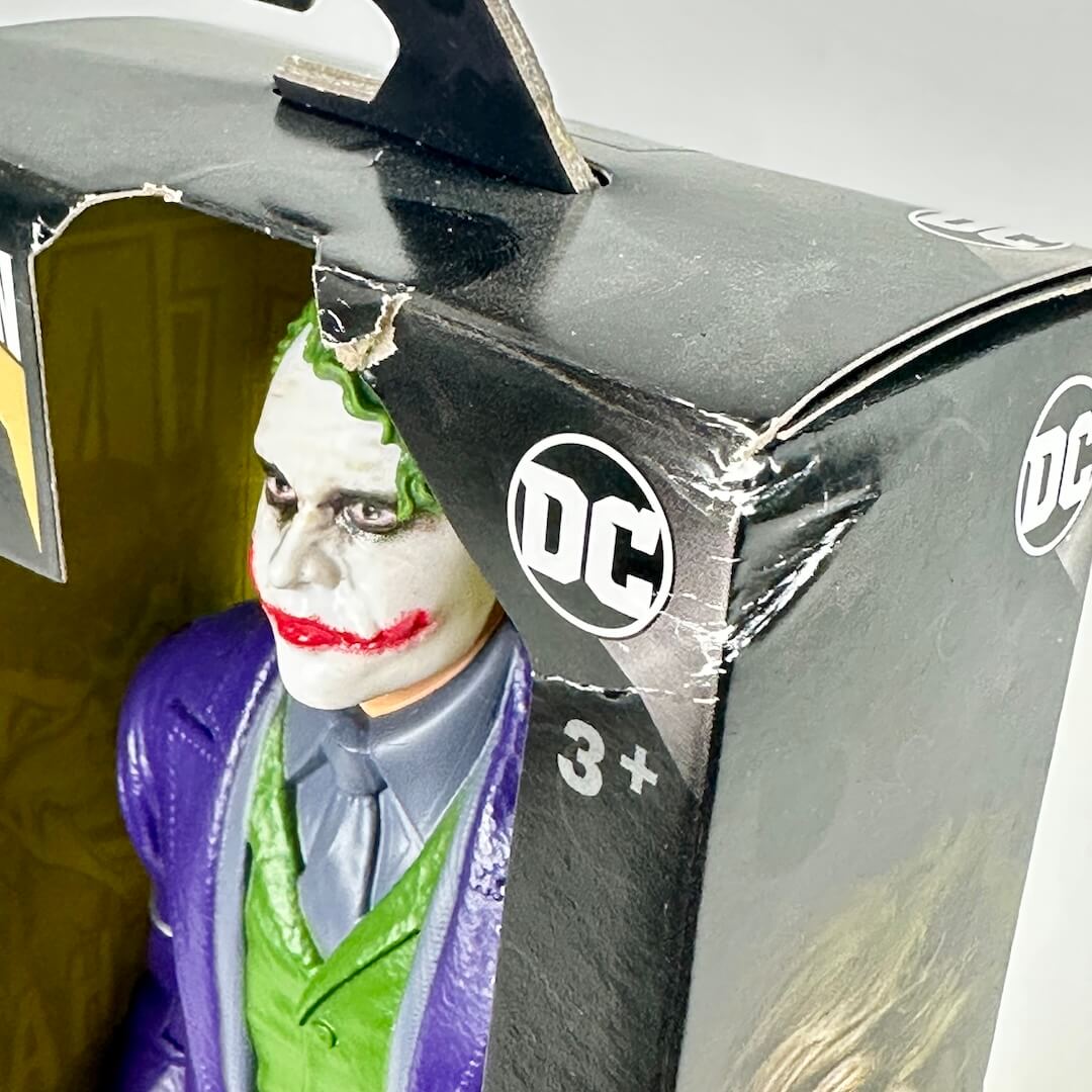 Toy figure of the Joker in a DC Comics packaging box