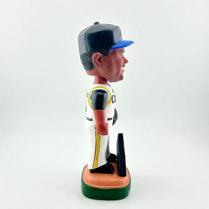 Bobblehead figure of a baseball player in a uniform with a cap on a white background