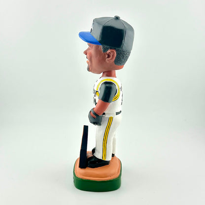 Bobblehead figure of a baseball player in uniform with a bat on a white background