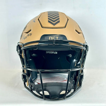 Football helmet with brown top and black face guard on a white background