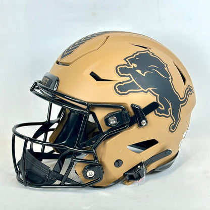 Brown football helmet with a black lion logo on a white background