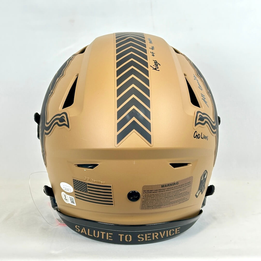 Brown helmet with 'Salute to Service' text on a white background
