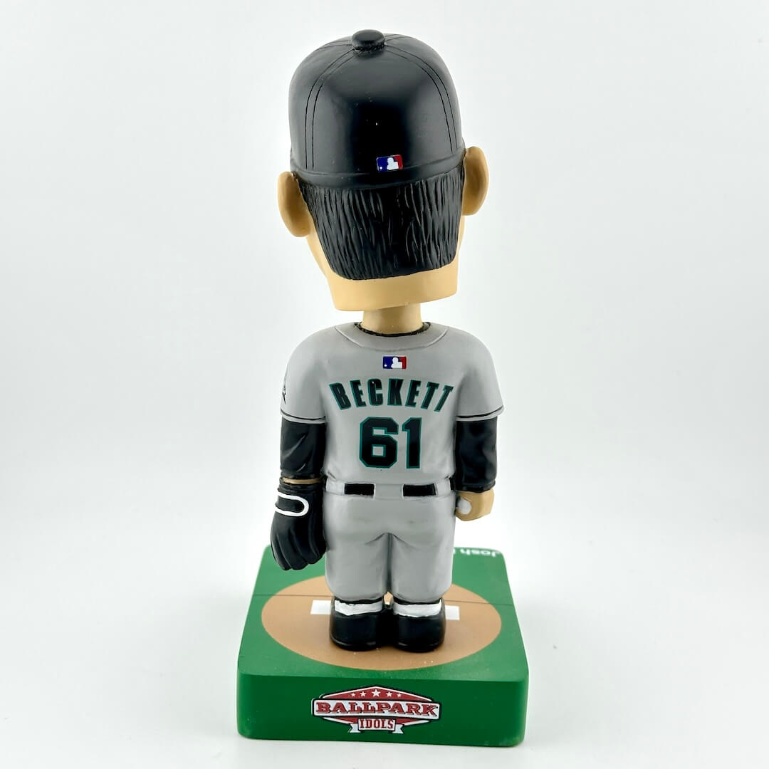 Baseball bobblehead figure with a black helmet and gray uniform on a white background