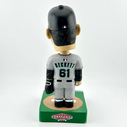 Baseball bobblehead figure with a black helmet and gray uniform on a white background