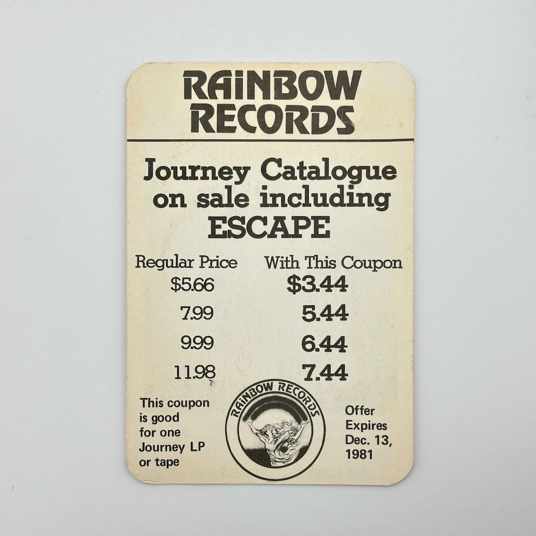 Backside of pass showing paper backing still attached. Also functions as a coupon for Journey record from Rainbow Records.