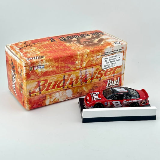 A Budweiser Dale Earnhardt Jr. 1998 #8 diecast car on a display stand, next to its original Budweiser-branded packaging.