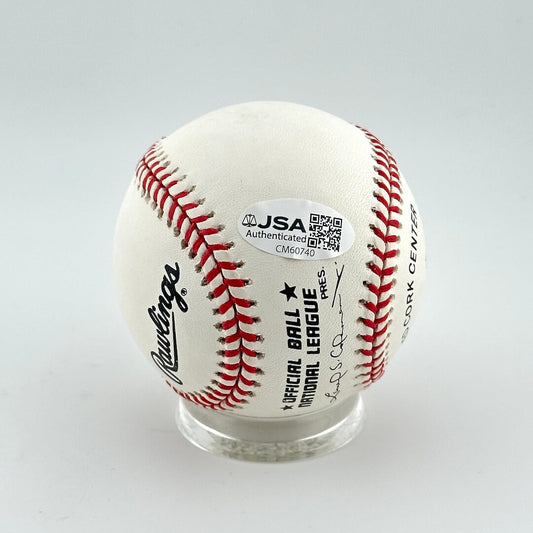 Baseball with JSA authentication label on a white background