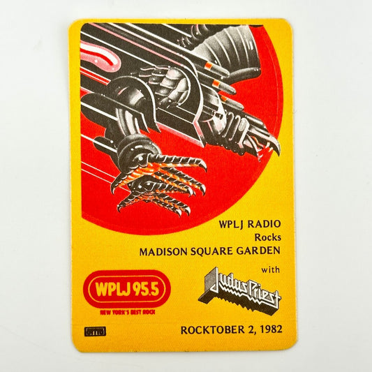 Yellow rectangular backstage pass with iron eagle illustration above event details in black text. 'Judas Priest' branding visible. 