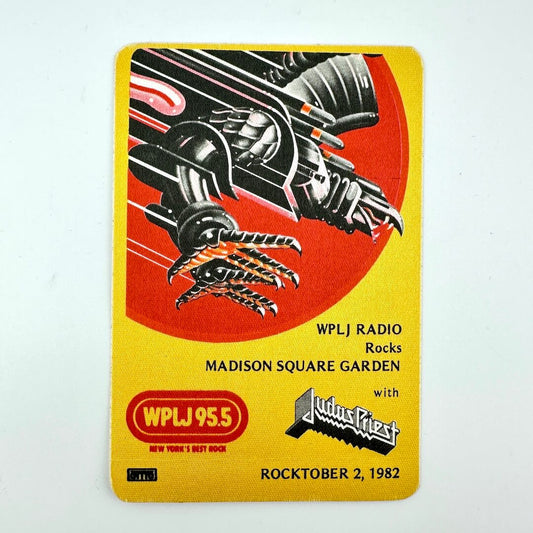 Yellow and red fabric backstage pass against white background. Image of stylized eagle at top corner. 