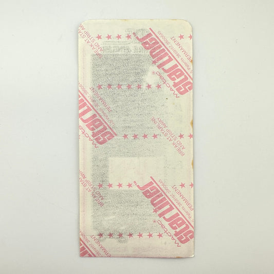 Backside of pass showing intact paper backing and mint condition. 