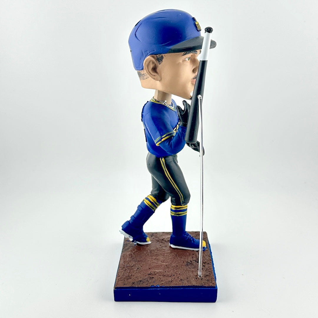 Baseball bobblehead figure in blue uniform with bat on a white background