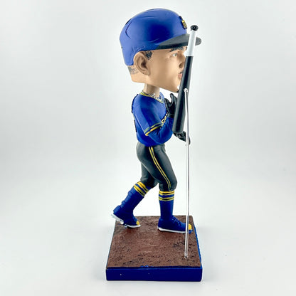 Baseball bobblehead figure in blue uniform with bat on a white background