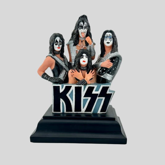 Black pedestal with icons of all members of KISS in full dress coming from top of KISS logo.