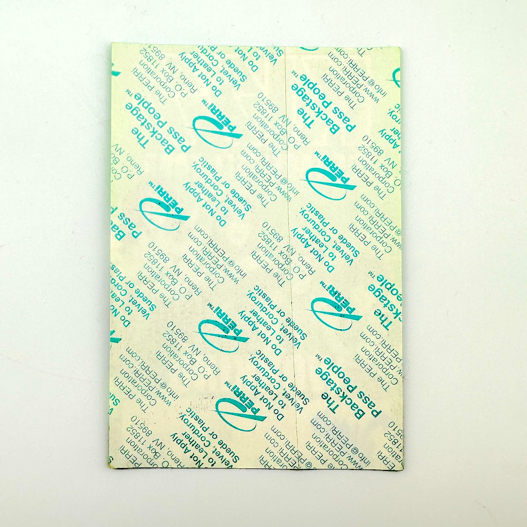 Backside of pass showing intact paper backing and mint condition. 