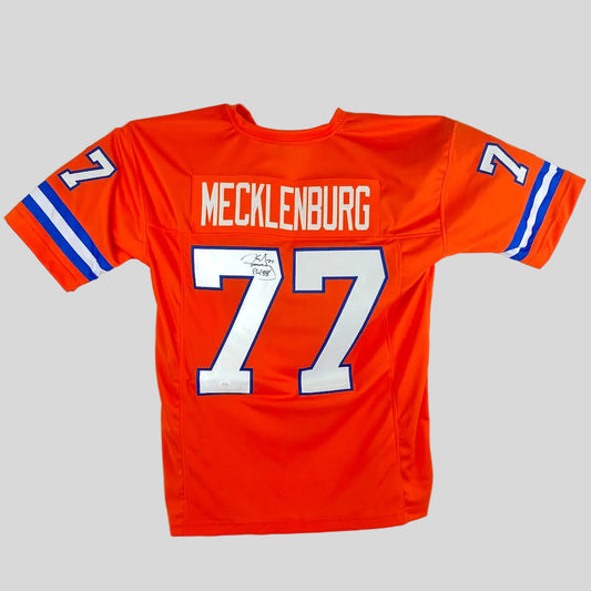 Orange sports jersey with 'Mecklenburg' and number '77' on a white background