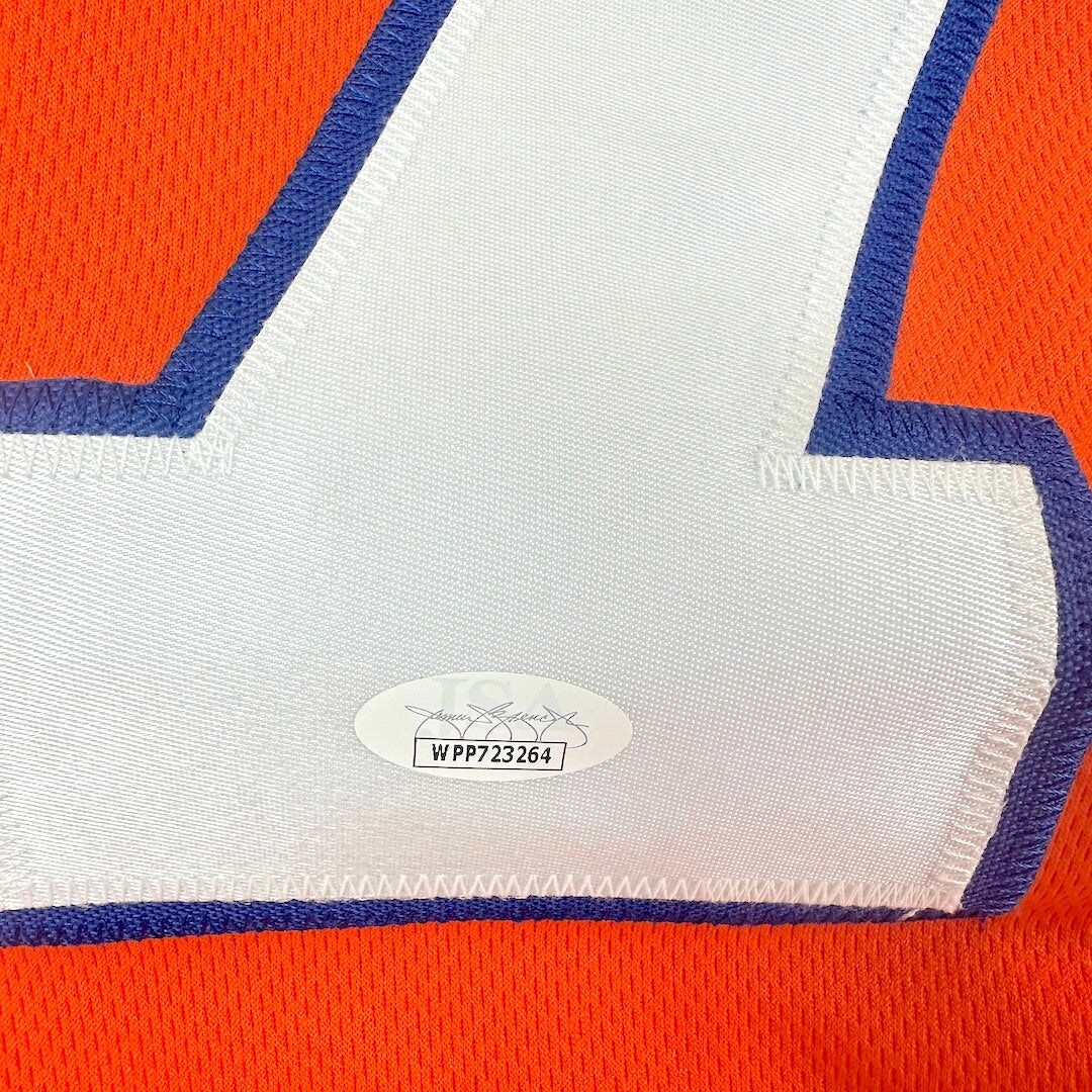 Close-up of a sports jersey with a number and brand label.