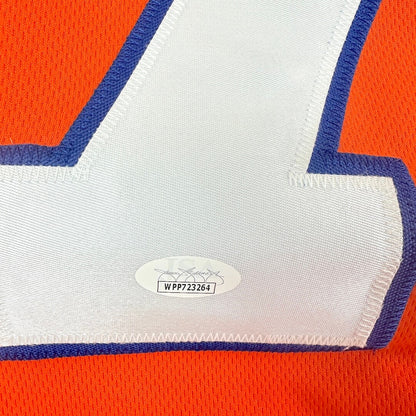 Close-up of a sports jersey with a number and brand label.