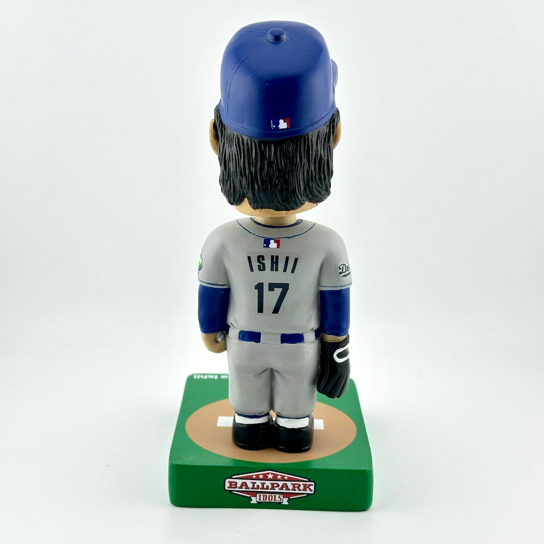 Baseball bobblehead figure with blue helmet and gray uniform on a white background