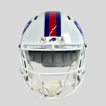 Football helmet with a blue and red stripe on a gray background