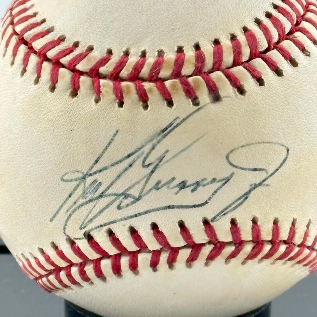 Close up of black pen signature in narrow section between red stitching, the "sweet spot. " 