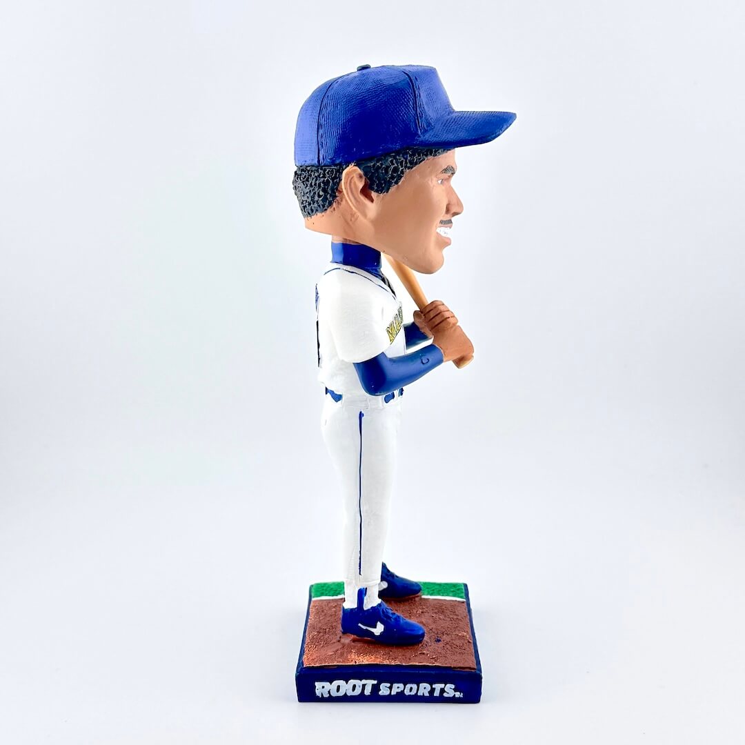 Baseball player bobblehead figure with blue and white uniform on a white background