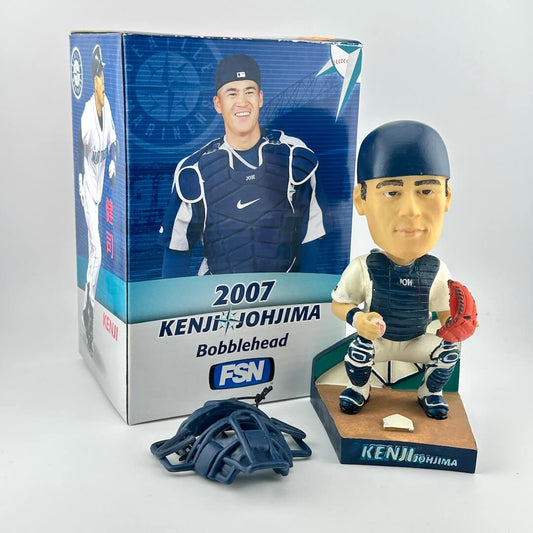 Bobblehead figure of a baseball player with packaging and glove on a white background