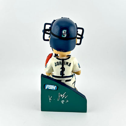 Baseball bobblehead figure with helmet and uniform on a stand against a white background