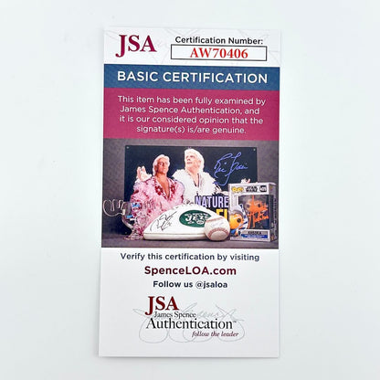 JSA certification card for basic authentication with a photo of two people and autographed items on a white background.