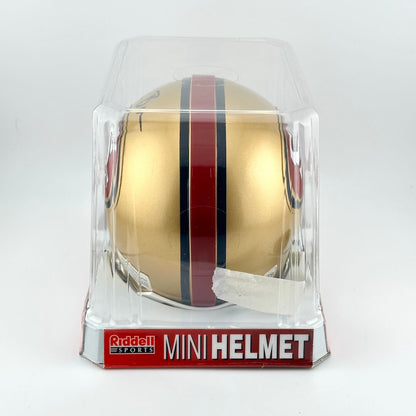Riddell mini football helmet in clear packaging on a white background