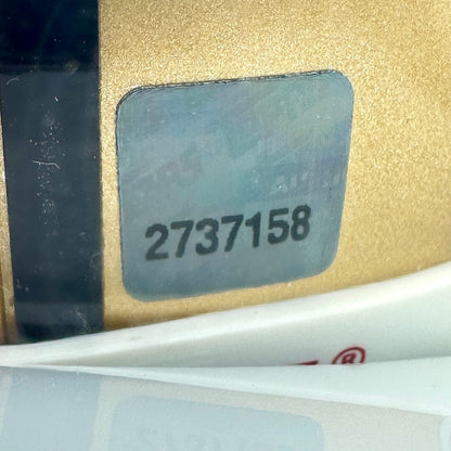 Close-up of authentication sticker with visible number. 