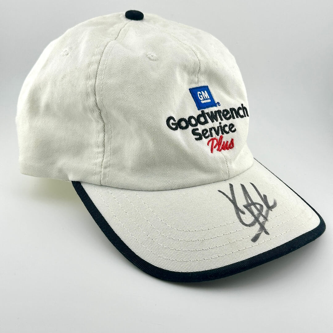 White cap with Goodwrench Service Plus logo on a gray background